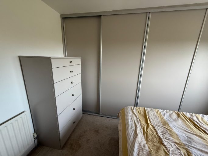 Bespoke, fitted 4 door sliding wardrobe with bespoke drawer unit in Chatham, Kent