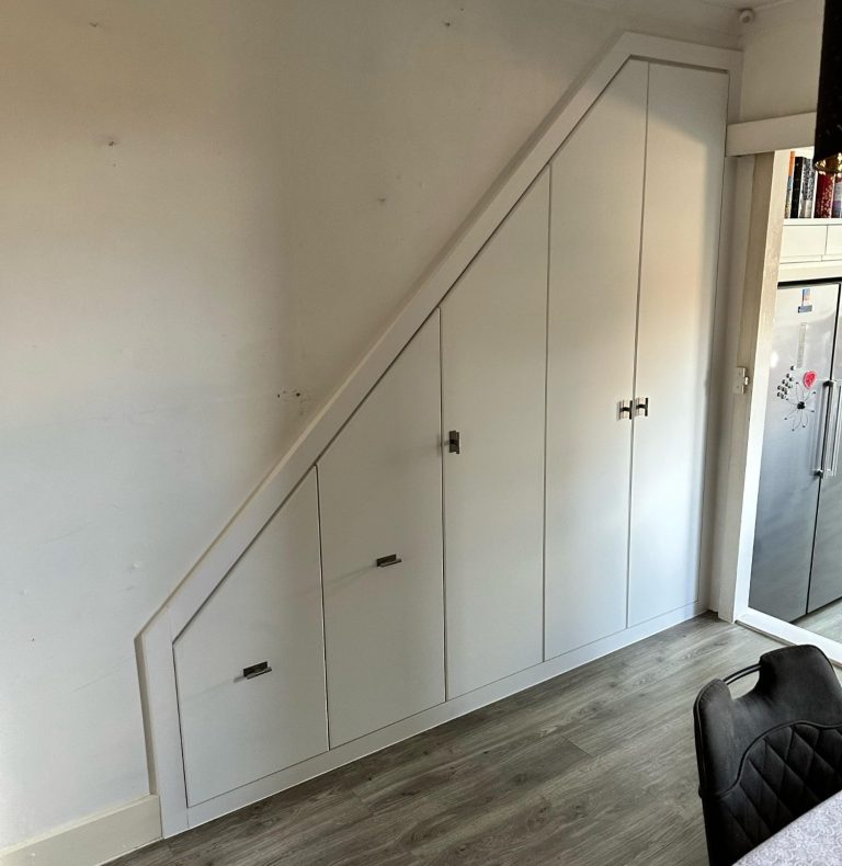 Made to measure, bespoke fitted understairs storage with pull out drawers and shelving cupboard in Kent and Maidstone.
