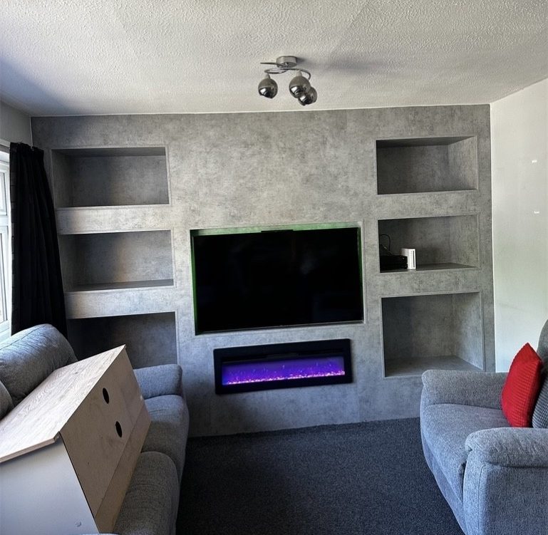 Bespoke fitted media wall with integrated fireplace in Chatham, Kent