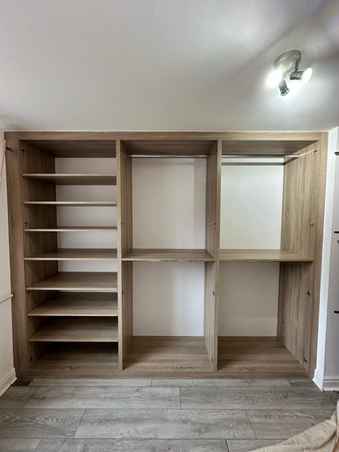 6 door made to measure, bespoke fitted hinged wardrobe in Sonoma oak with 4 lots of double hanging clothe space and adjustable shelves.