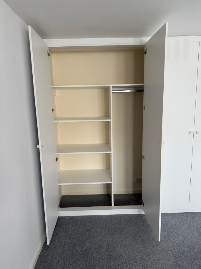 4 door made to measure, bespoke fitted wardrobe in Kent and Maidstone with long hanging space and fixed shelving.