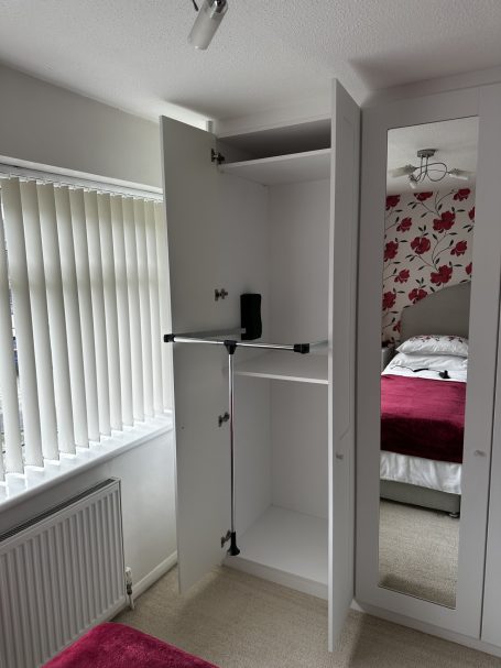 Pull down rail for bespoke fitted wardrobe in Kent and Maidstone.