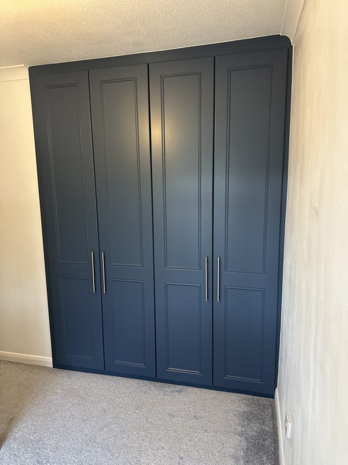 4 door made to measure, bespoke fitted hinged wardrobe in Alby blue in Kent.