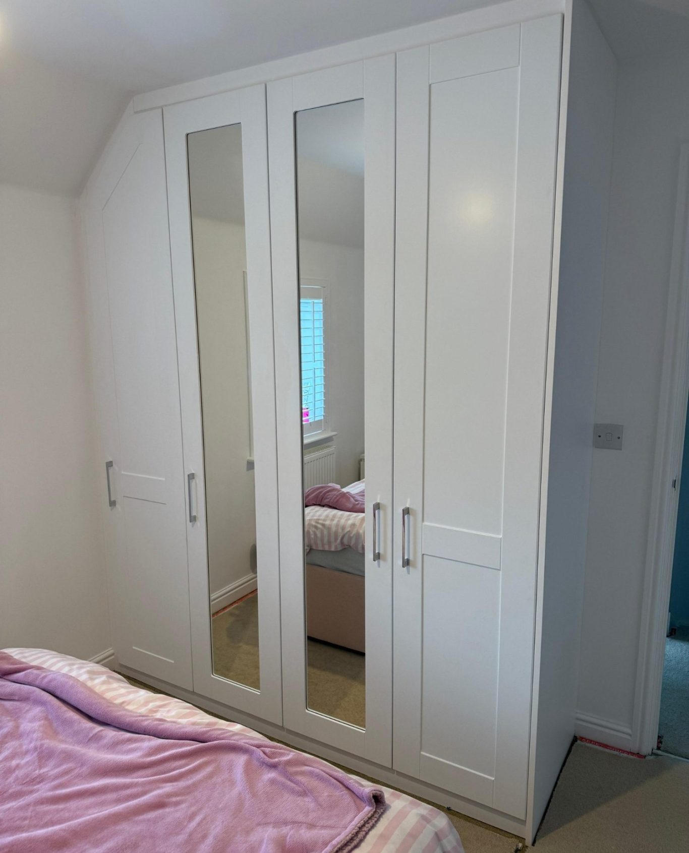 Custom made, bespoke fitted angled wardrobe in Chatham, Kent
