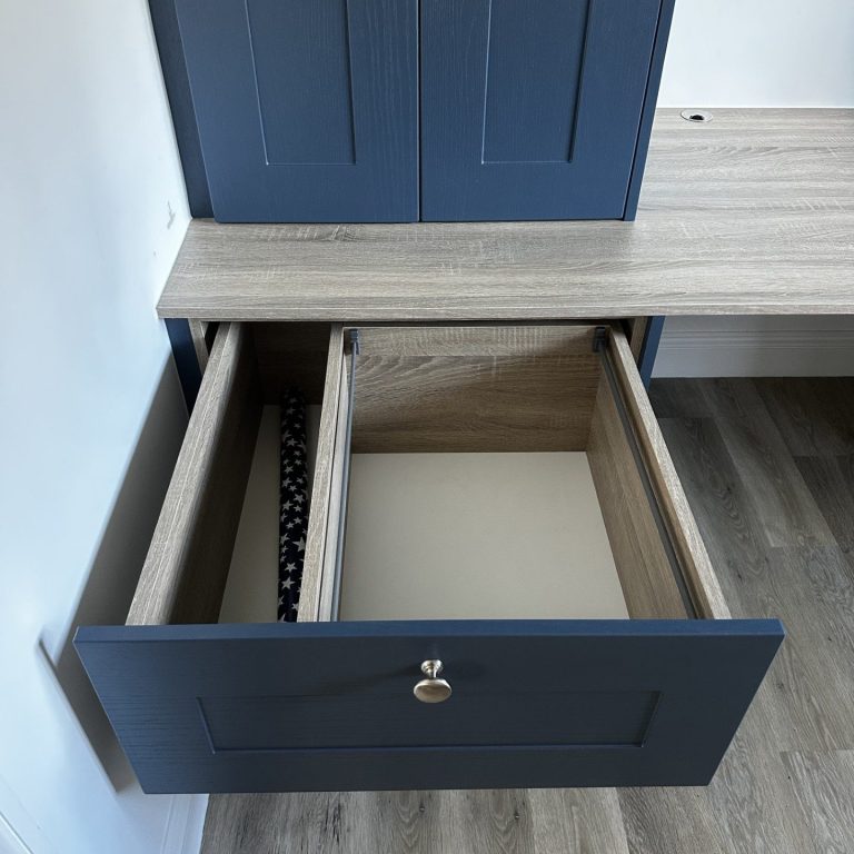 Made to measure, bespoke fitted file drawers with divider for wrapping paper.