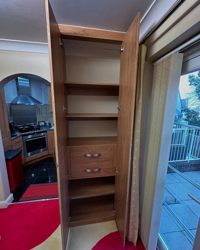 2 door made to measure, bespoke fitted, made to measure wardrobe in Winchester oak with 2 soft closing drawers and fixed shelving in Kent.