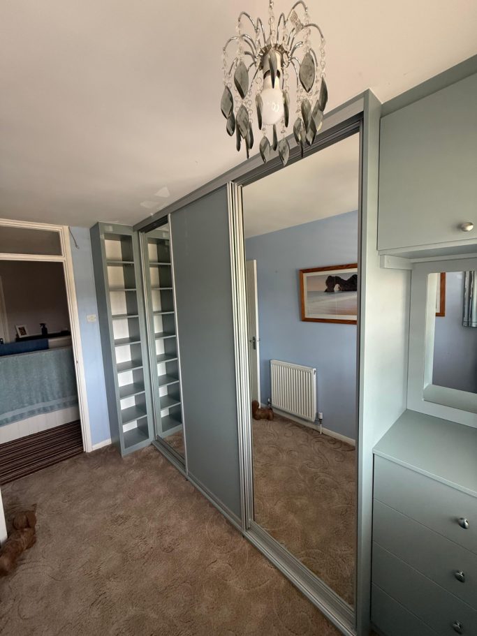 3 door sliding wardrobe with fitted drawer unit, framed mirror and overhead storage in Kent and Maidstone.