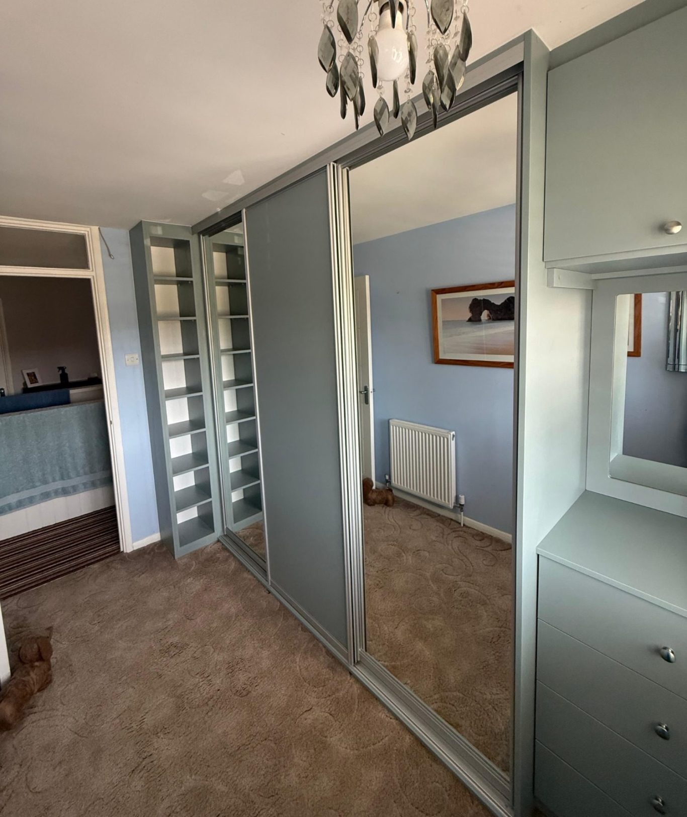 3 door sliding wardrobe with fitted drawer unit, in Kent and Maidstone 3 door sliding wardrobe with fitted drawer unit, framed mirror and overhead storage in Kent and Maidstone.