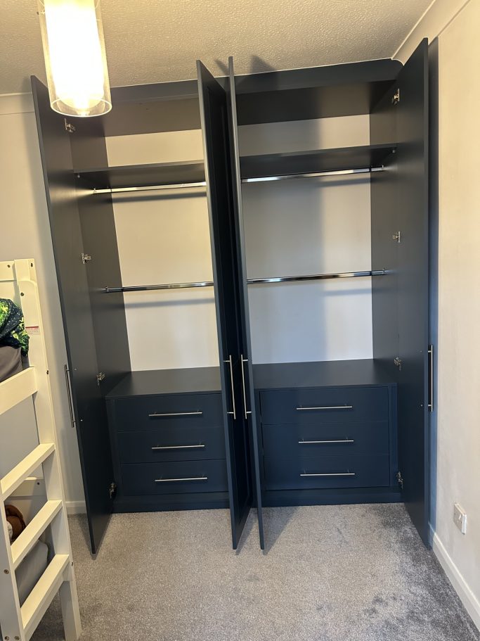 4 door made to measure, bespoke fitted hinged wardrobe in Alby blue with double hanging clothe space and 6 soft closing drawers.