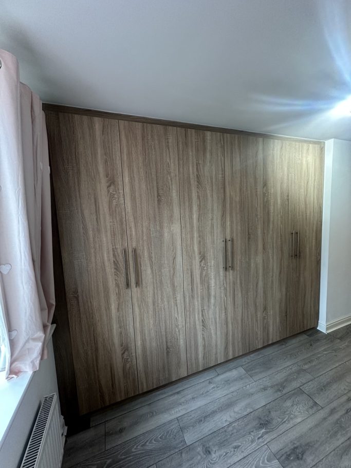 6 door made to measure, fitted hinged wardrobe in Sonoma oak in Kent.