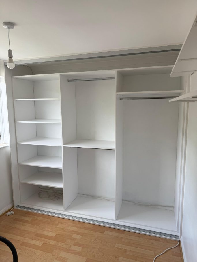 3 door bespoke fitted sliding wardrobe with full mirrored door, double hanging space and shelving in Kent and Maidstone.
