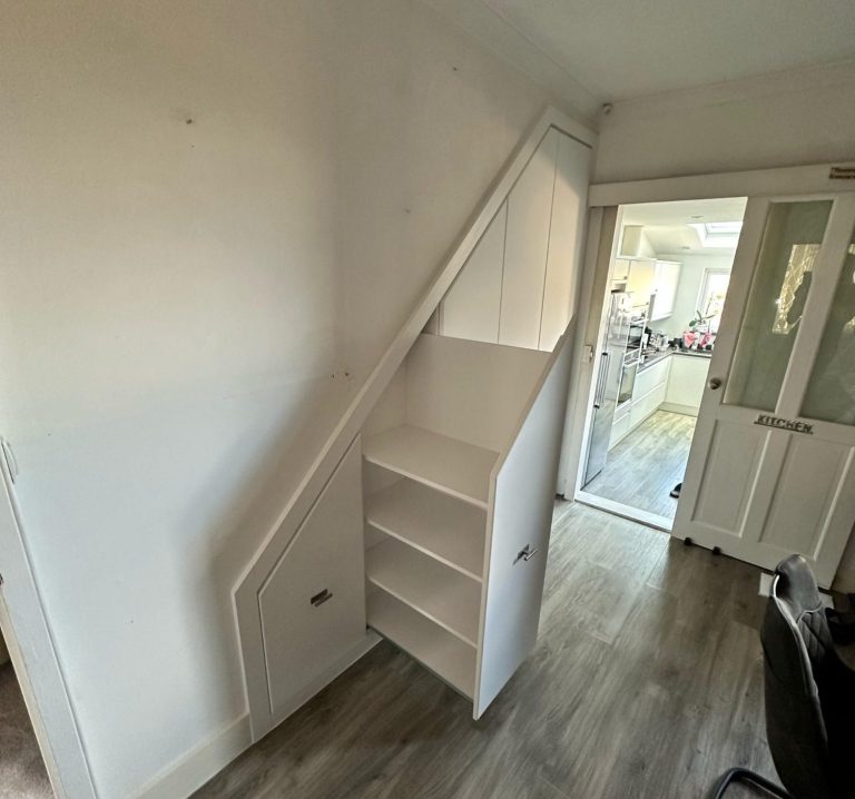 Made to measure, bespoke fitted understairs storage with pull out drawers and shelving cupboard in Kent and Maidstone.