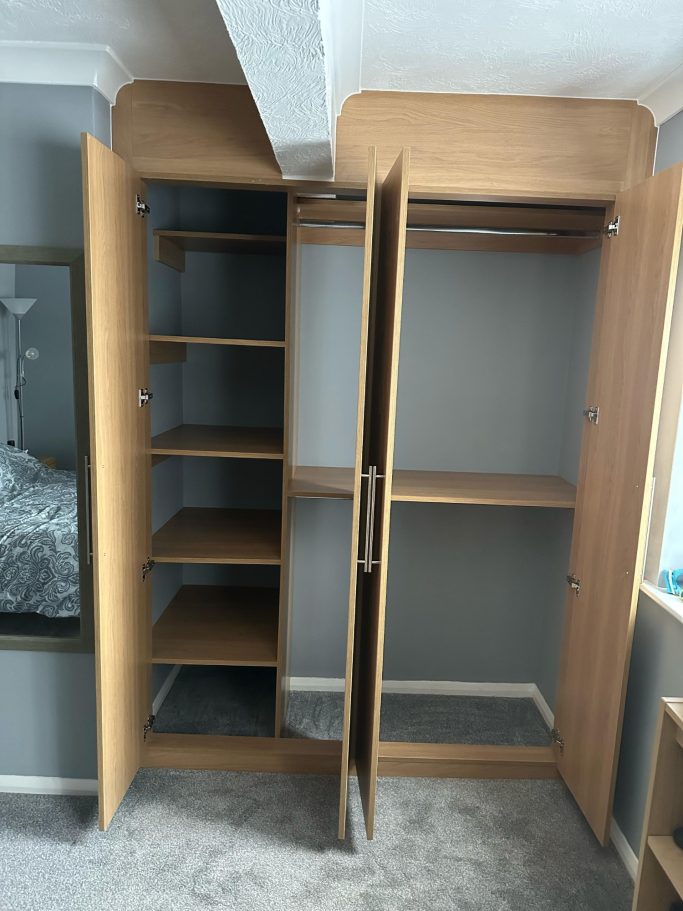 4 door bespoke fitted, made to measure wardrobe in Lissa oak. Interior including fixed shelving and double hanging space in Kent.