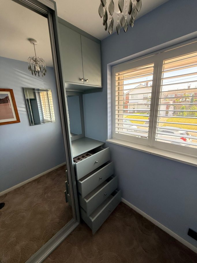 3 door sliding wardrobe with fitted drawer unit, framed mirror and overhead storage in Kent and Maidstone.